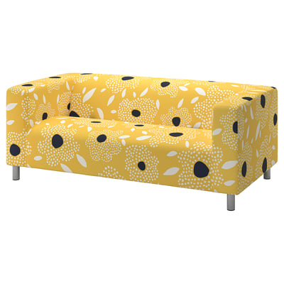 Leuchtend gelb gemustertes KLIPPAN 2-Sitzer-Sofa, mit Punkten und Linien auf Stoff, Stahlbeinen.