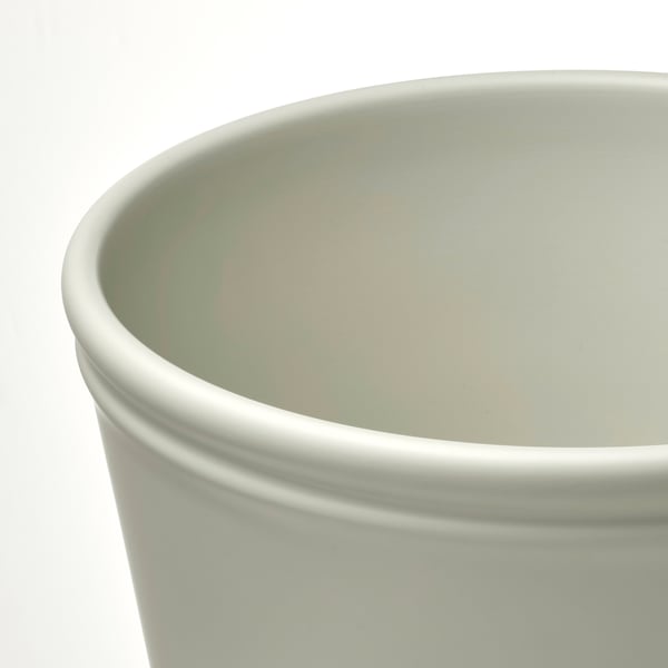 Rundes, hellgrünes Pflanzgefäß mit glatter, glänzender Oberfläche. Einfaches Design, wirkt robust und gut verarbeitet.
