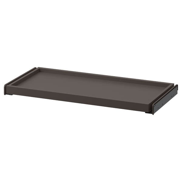 Ein ausziehbares Tablett von ikea KOMPLEMENT in Dunkelgrau mit schlankem, rechteckigem Design, perfekt für die Aufbewahrung leichter Kleidung.