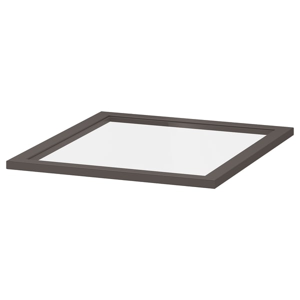 Ein graues quadratisches Glasregal von ikea KOMPLEMENT mit einem robusten Rahmen, ideal für Schränke.