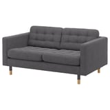 Modernes dunkelgraues Stoffsofa, getuftete Sitze, Holzbeine.