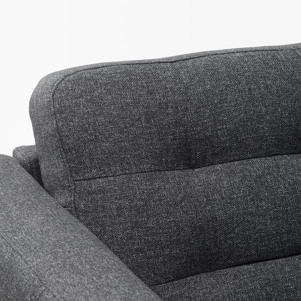 Dunkelgraues Sofa mit schlanken, modernen Linien; weicher, gepolsterter Stoff; Robustes, komfortables Design.