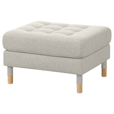Moderner grau gepolsterter Fußhocker mit Holzbeinen, getuftetes Design.