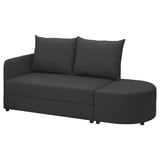 Dunkelgraues LINDÅKRA Schlafsofa mit runden Formen, zwei Rückenkissen und Stauraum in Sitz und Ottomane.