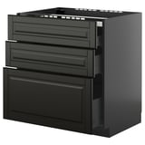 Schwarzer METOD-Küchenschrank mit abgeschrägten Kanten, mehreren Schubladen. Modernes, minimalistisches Design.