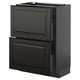 Moderne schwarze Küchenzeile mit glatten Schubladen und Schrank.
