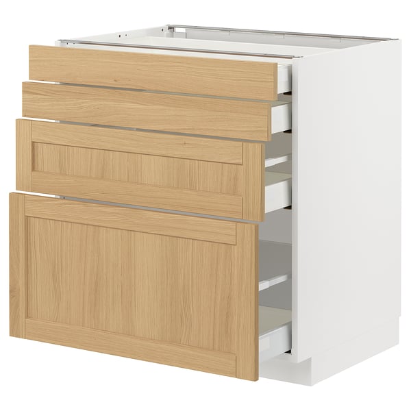 Ein weißer METOD-Küchenschrank mit mehreren Schubladen aus hellem Eichenholz. Es ist ein klassisches Design mit glatter Oberfläche und abgeschrägten Kanten.