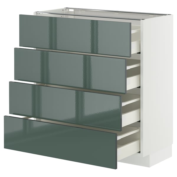 Moderner graugrüner Küchenschrank mit schlanken, glänzenden Schubladen in weißem Rahmen.