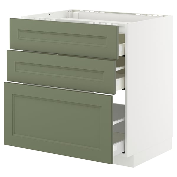 Ein weißer METOD-Küchenschrank mit drei grünen Schubladen. Die Schubladen sind ordentlich organisiert und der Schrank hat ein schlankes, modernes Design.