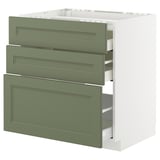 Ein weißer METOD-Küchenschrank mit drei grünen Schubladen. Die Schubladen sind ordentlich organisiert und der Schrank hat ein schlankes, modernes Design.