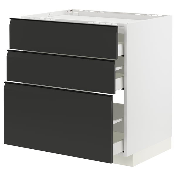 Ein moderner schwarz-weißer Küchenschrank mit drei Schubladen. Der Schrank hat ein schlankes, minimalistisches Design mit integrierten Griffen.