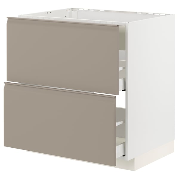 Moderner Küchenschrank, beige, quadratisch, mit schlanken grauen Griffen.