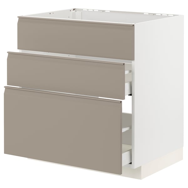 Moderner Küchenschrank in Grau-Beige mit glatten Schubladen und grifflosem Design.