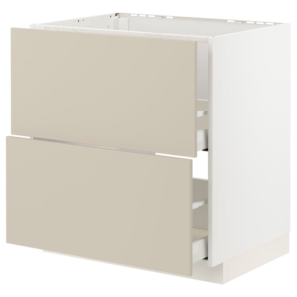 Ein cremefarbener METOD-Küchenschrank mit beigen Havstorp-Fronten in glattem, rechteckigem Design mit integrierten Schubladen.