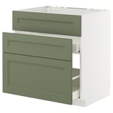 Moderner grün-weißer Küchenschrank mit integrierten Schubladen, schlanken Paneelen und glatten Griffen. Effiziente Lagerung, schlankes Profil.