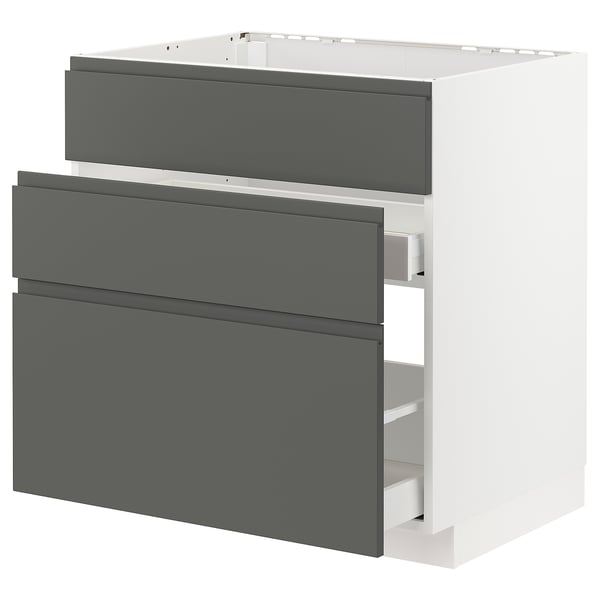 Moderner grauer Küchenschrank mit drei Schubladen, minimalistisches Design.