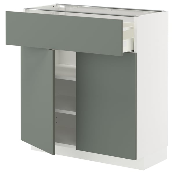 Moderne Küchenaufbewahrung: weißer METOD-Schrank mit grün-grauer Schublade und Doppeltüren.