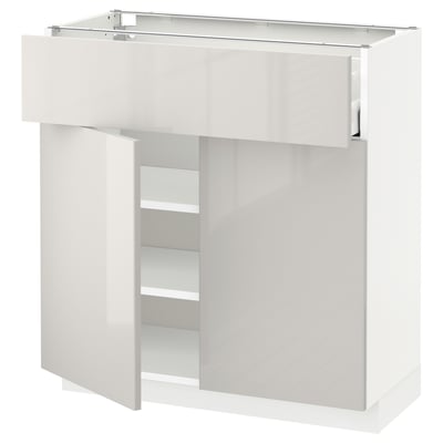 Weißer Hochglanz-Küchenschrank mit Einlegeböden und Schubladen; Schlankes, modernes Design.