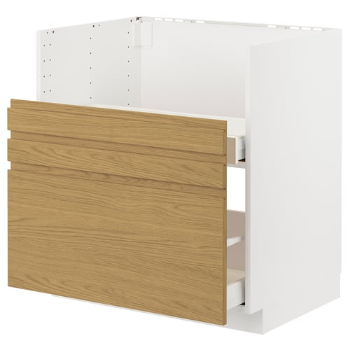 Moderner weißer Küchenschrank mit Eichenfront, minimalistisches Design.