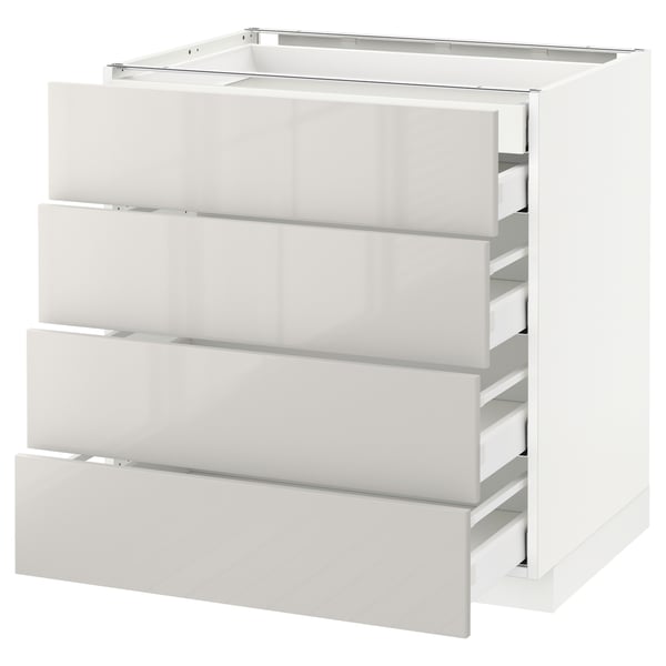Weißer IKEA METOD Küchenschrank mit vier ausziehbaren Schubladen, glänzende Oberfläche.