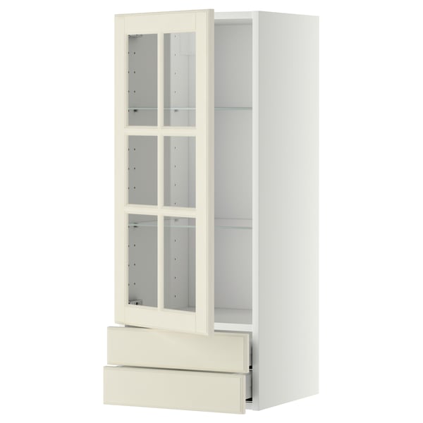 METOD Küchenzeile: weißer Schrank mit Glastüren, verstellbaren Regalen und einer Schublade. Traditionelles Design mit abgeschrägten Kanten.