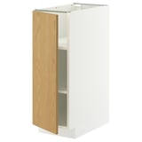 Dieses Bild zeigt einen weißen METOD-Schrank mit einer hellen Holztür und verstellbaren Einlegeböden.