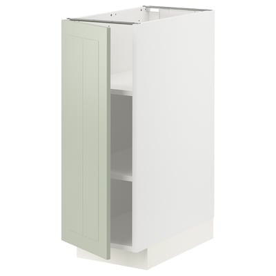 Ein weißer METOD Küchenschrank mit grüner Stensundtür. Es ist rechteckig mit verstellbaren Regalen und einem schlanken, modernen Design.