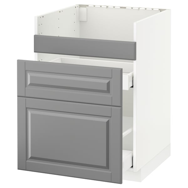 Moderner grauer Küchenschrank, weißes Interieur, drei Schubladen, abgeschrägte Kanten.