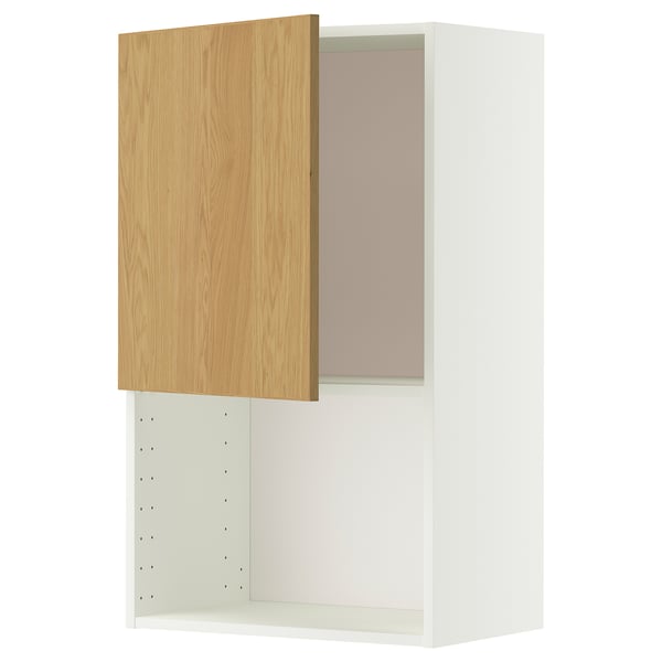 Ein weißer METOD-Wandschrank mit einer hellen Eichentür. Der Schrank hat ein modernes Design und verfügt über ein verstellbares Regal im Inneren.