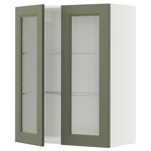 Wandschrank mit grüner Glastür und verstellbaren Regalen.