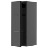 Ein schwarzer moderner Küchenschrank mit Glastür mit Metallrahmen und vertikalem Schilfdesign, Teil des METOD-Systems.