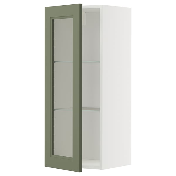 Ein METOD-Küchenschrank mit einer axstad-Glastür in Graugrün und verstellbaren Regalen.