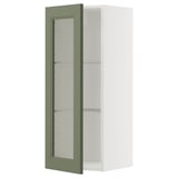 Ein METOD-Küchenschrank mit einer axstad-Glastür in Graugrün und verstellbaren Regalen.