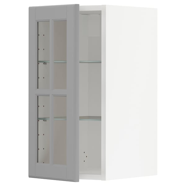 Ein weißer METOD-Küchenschrank mit grau getönten Glastüren und verstellbaren Glasböden.