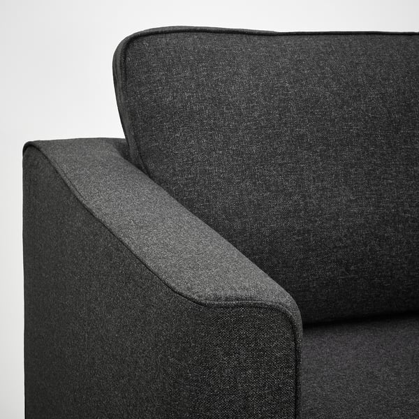Dunkelgraues Sofa, schlankes und modernes Design, weiche Kissen, hochwertige Polsterung, einladender Komfort.