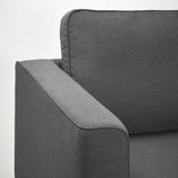 Nahaufnahme eines modernen grauen Stoffsofas mit weicher, strapazierfähiger Polsterung und schlankem Armlehnendesign.