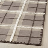 Teppich aus Schottenkaro-Wolle, handgewebt in Braun- und Grautönen, der hohe Handwerkskunst mit sichtbarer Textur und kompliziertem Muster zeigt.