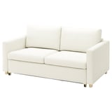 Ein weißes SALTSJÖBADEN-Sofa aus einem hellen, leuchtenden Baumwollstoff. Seine Form ist rechteckig mit einem modernen, schlanken Design und Holzbeinen.
