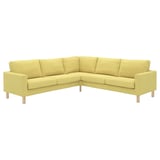 Ein limettengrünes IKEA SALTSJÖBADEN Ecksofa mit leichten Holzbeinen, mit rechteckiger Form und minimalistischem Design.