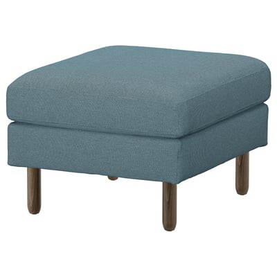 Blauer Stoffhocker mit Holzbeinen. Quadratisch, modernes Design.