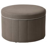 Runder Hocker aus grauem Stoff, schlankes Design mit verstecktem Stauraum.