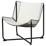 SKÅLBODA Stuhl: weißes Kissen, schwarzes Metallgestell, schlankes, modernes Design.