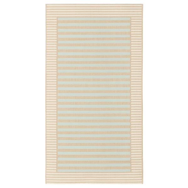Eine SKEVNING Läuferdecke, beige in der Farbe, rechteckig in der Form mit gestreiftem Design, geeignet für den Innen- und Außenbereich.