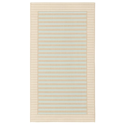 Eine SKEVNING Läuferdecke, beige in der Farbe, rechteckig in der Form mit gestreiftem Design, geeignet für den Innen- und Außenbereich.