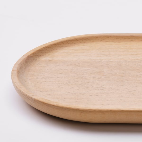 Handgefertigtes Tablett aus Holz mit glatter, natürlicher Oberfläche und abgerundeten Kanten.