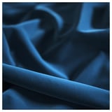 Weiche, tiefblaue Samttextur aus nächster Nähe, die luxuriöse, glatte Materialqualität zeigt.