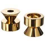 Kerzenständer aus goldenem Metall, wendbares Design, robust, Teelichter oder hohe Kerzen, glänzende Oberfläche.