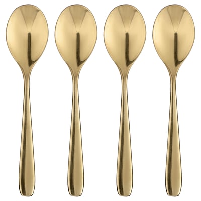 Vier elegante, goldene Löffel, die ordentlich angeordnet sind und das Licht reflektieren, mit schlanken Griffen und abgerundeten Schalen, perfekt zum Nachtisch.