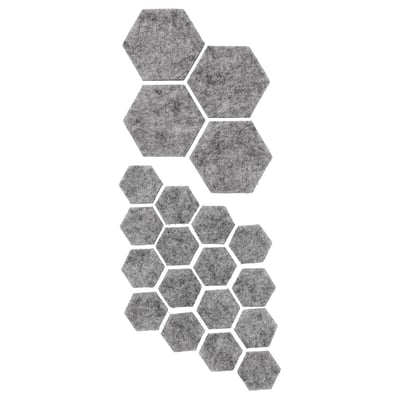 Ein Satz grauer sechseckiger Filzgleiter, die entwickelt wurden, um Oberflächen zu schützen und Kratzer zu vermeiden, mit selbstklebenden Rückseiten für eine einfache Befestigung.