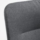 Eleganter, dunkelgrauer Sessel mit glatten Linien und stützender Rückenlehne, der hohe Qualität und Komfort ausstrahlt.